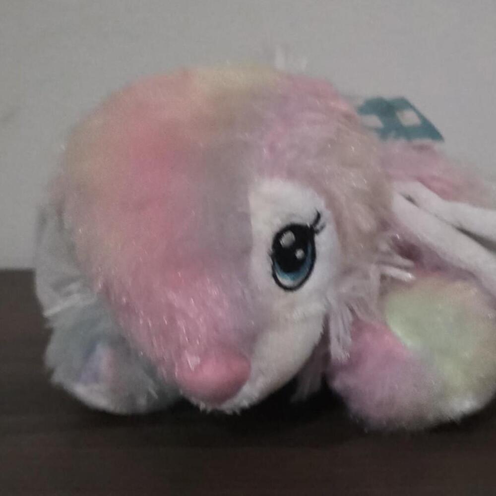 Rainbow unicorn plushie with pink, white, and light blue fur #unicorn #rainbow
